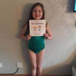 Picture of gymnast using gymnastics story book