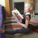 Picture of gymnast using gymnastics story book